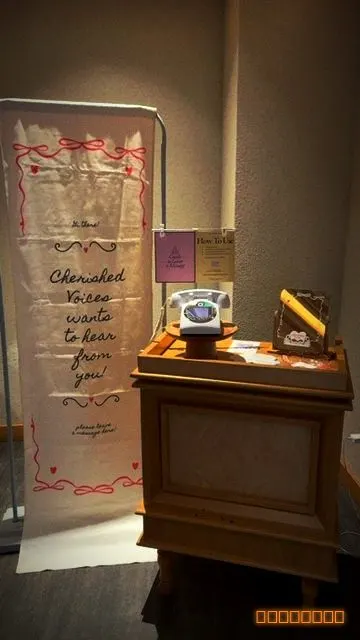 A guestbook table with a sign that reads 'we want to hear from you'