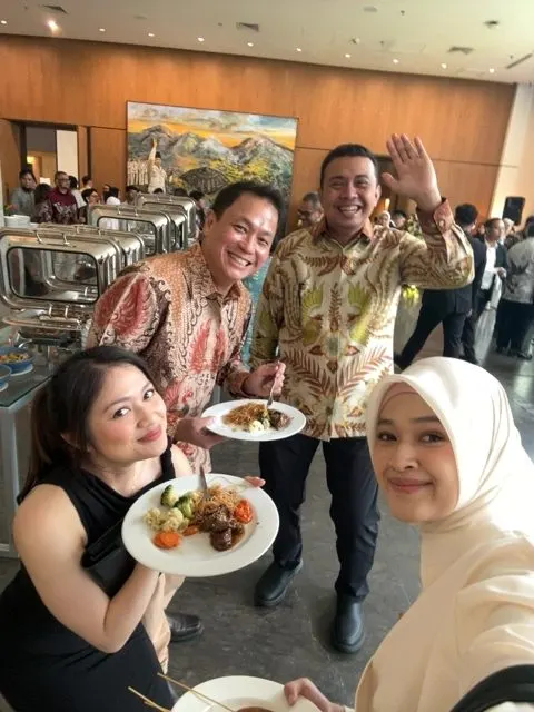 Guests taking a selfie at the buffet