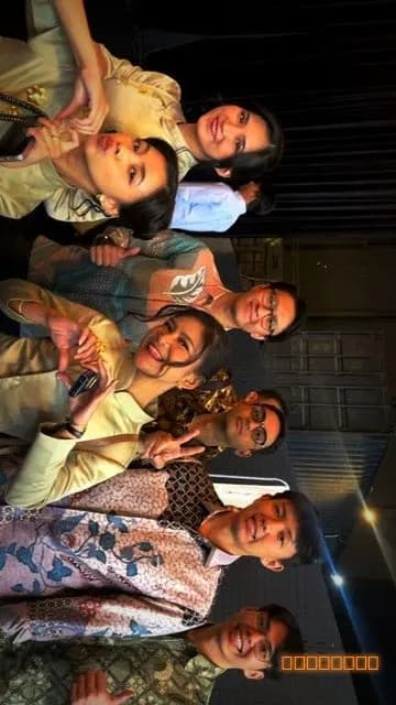 A big group selfie of wedding guests