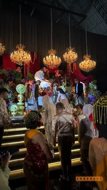 A grand wedding ceremony under chandeliers